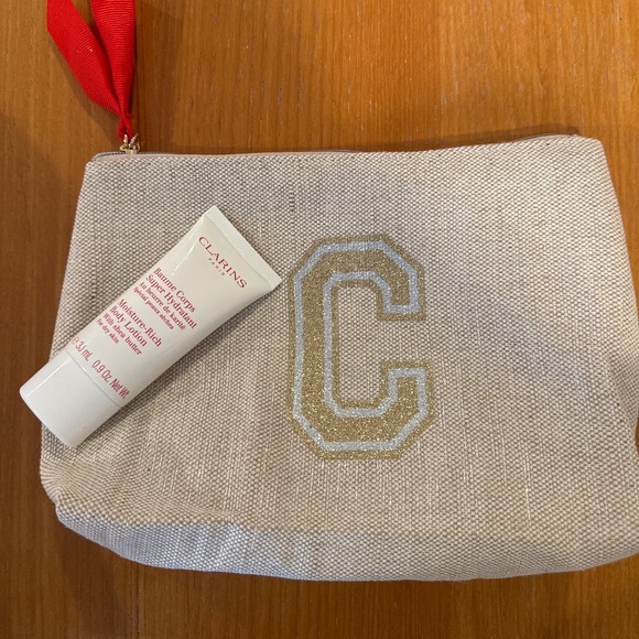 Clarins Cosmetic bag and body Lotion - Picture 1 of 5